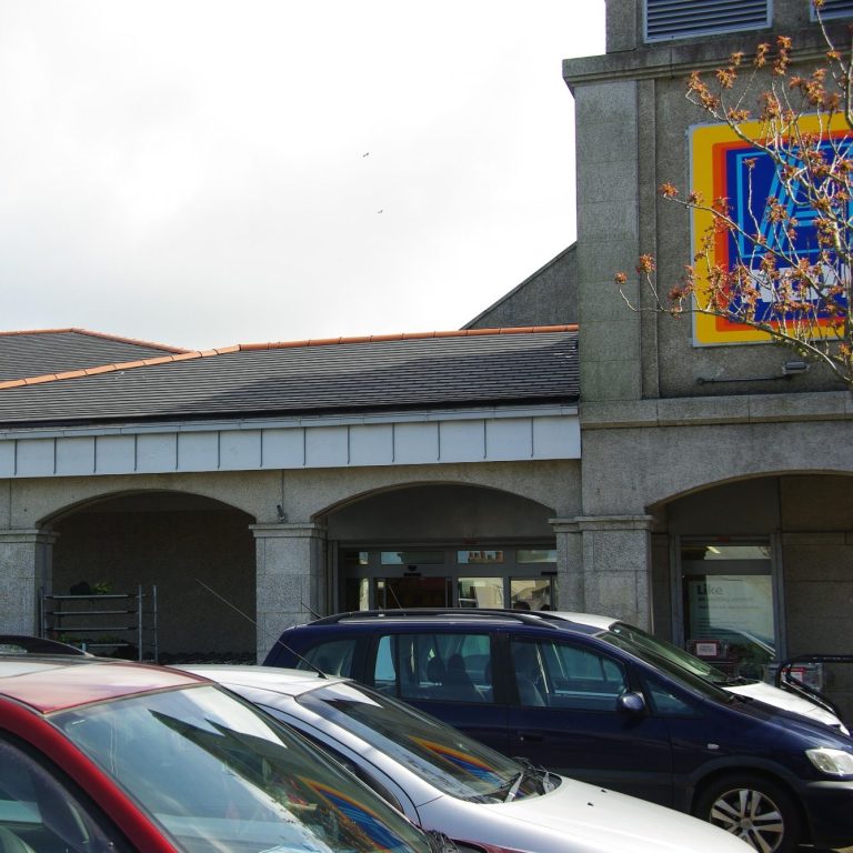 Aldi supermarket building featuring a roof fitted with Envirotile recycled plastic roof tiles, demonstrating commercial use 